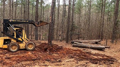 skid steer pushing trees|new holland skid steer stump bucket.